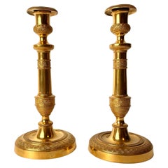 Pair of Large and Sophisticated Empire Candlesticks in Gilded Bronze