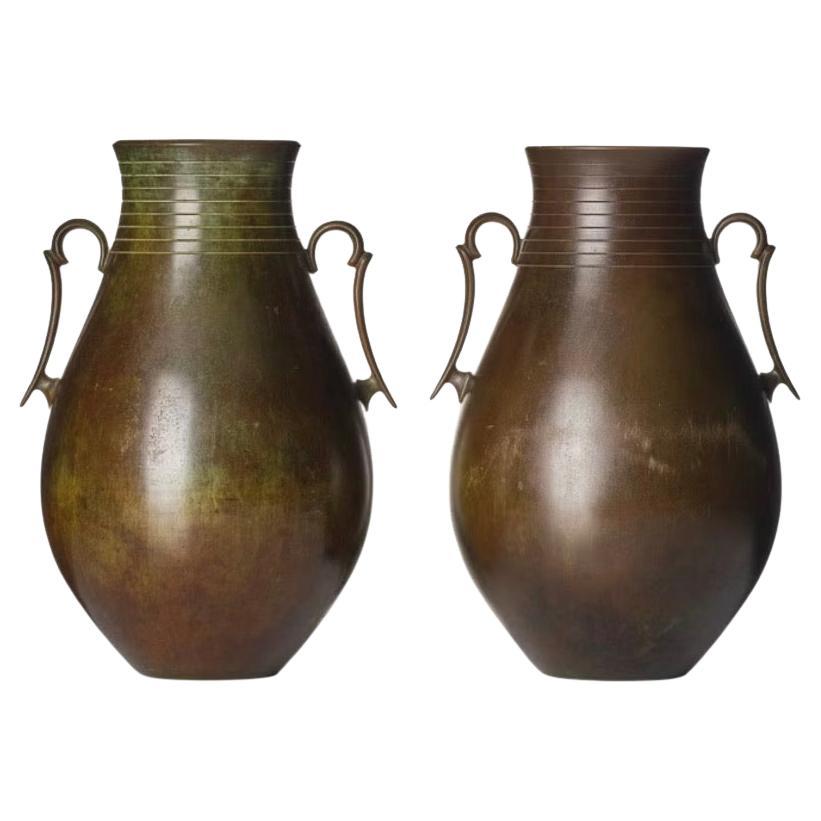 A pair of large bronze vases by GAB