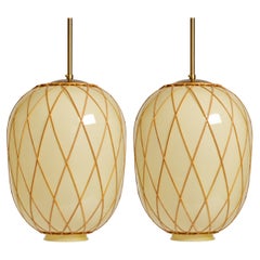 A pair of large ceiling lamps by Harald Notini