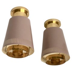 A pair of large  ceiling lights by Paavo Tynell, Model 9067