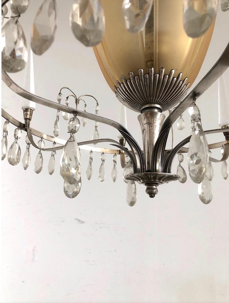 Cut Glass A pair of large Chandeliers by Elis Bergh For Sale
