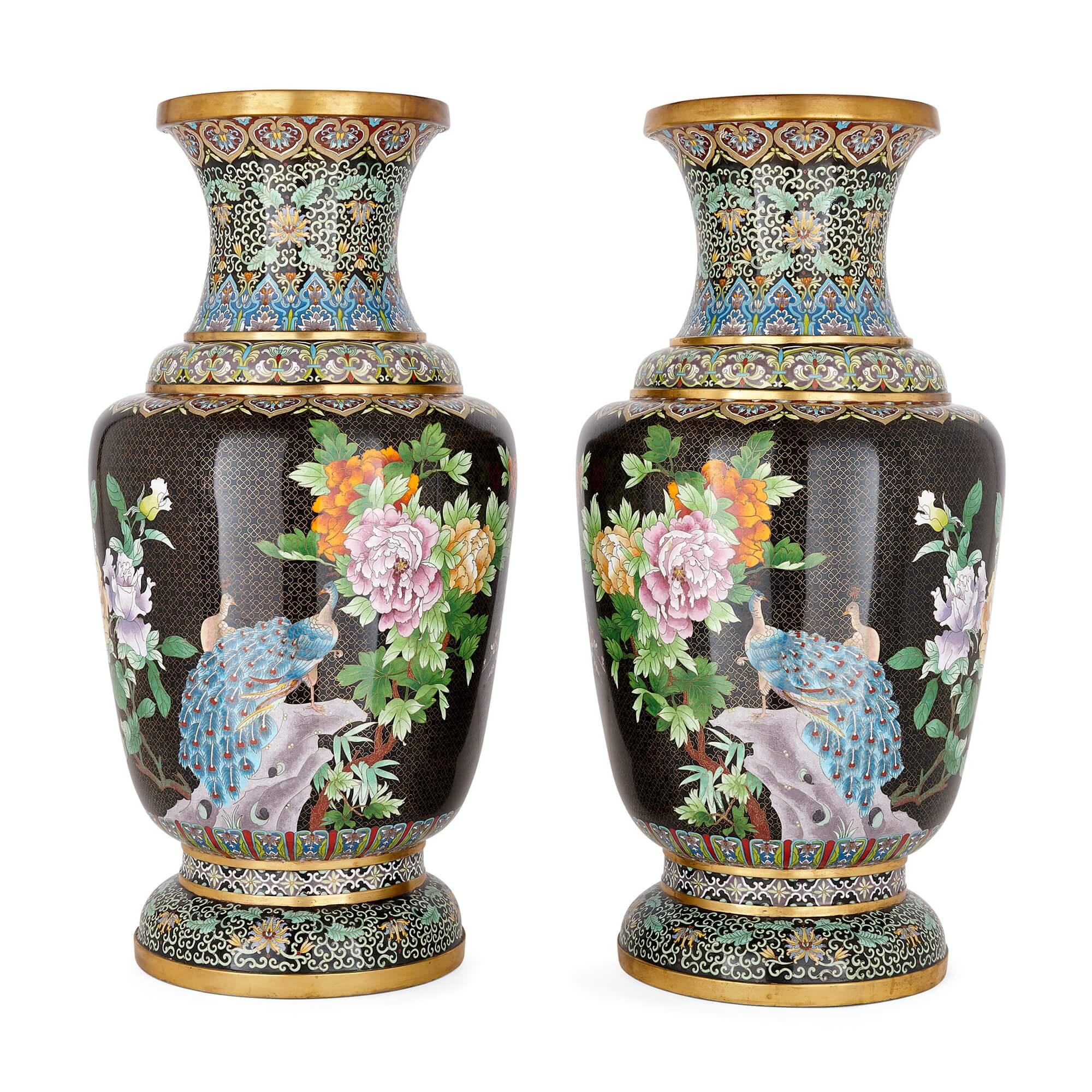 A pair of large Chinese gilt and black ground cloisonné enamel vases
Chinese, 20th Century 
Height 67cm, diameter 38cm

These beautiful vases are exceptional examples of Chinese cloisonné enamel decorative art. This popular and highly effective