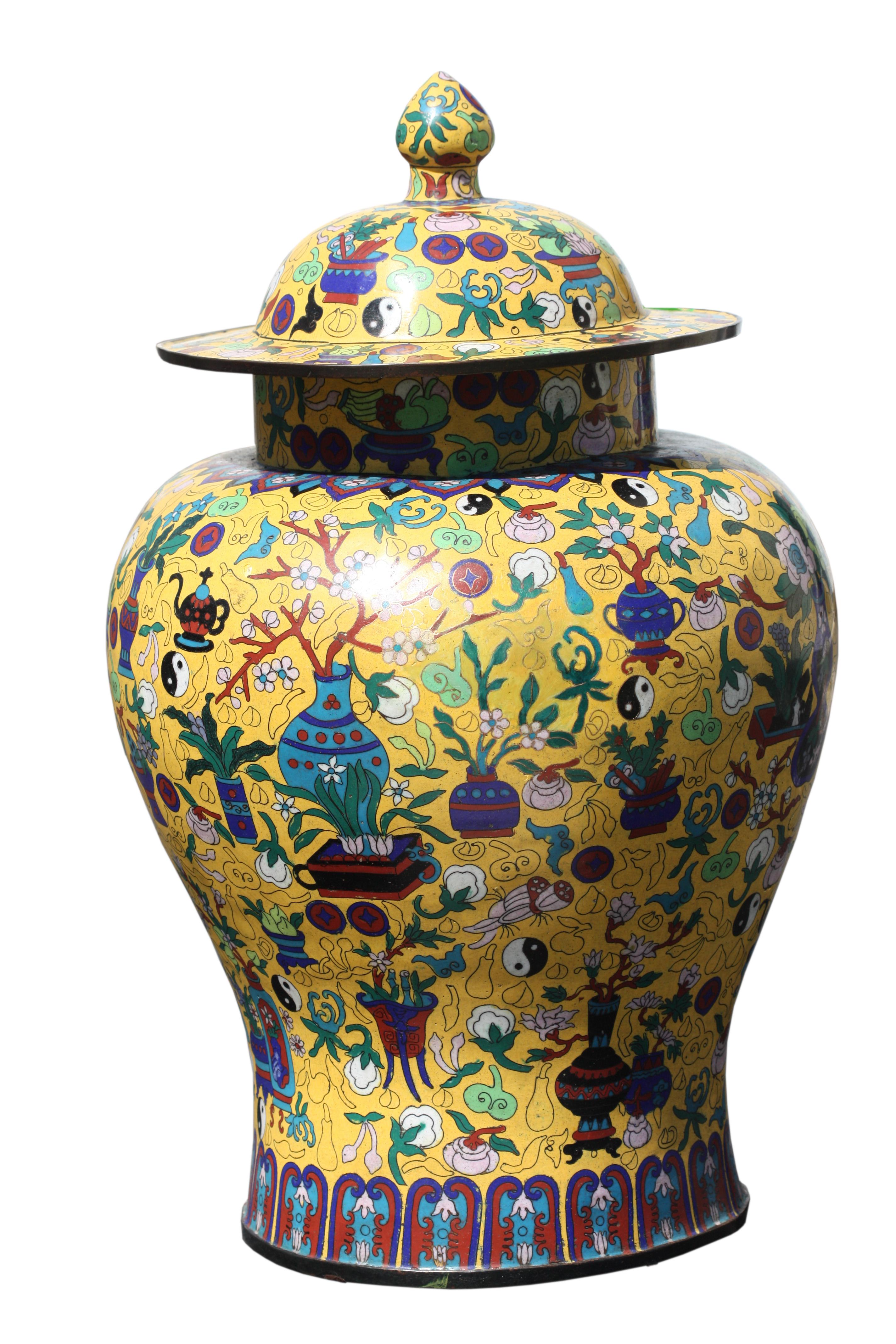 A Pair of Large Cloisonne Enamel Vases and Covers 
Chinese, late 20th century
Brightly enameled flowers in pink, orange and blue, with soaring birds and butterflies on a soft yellow ground of small cloud forms. Footed bases with blue stylized ruyi