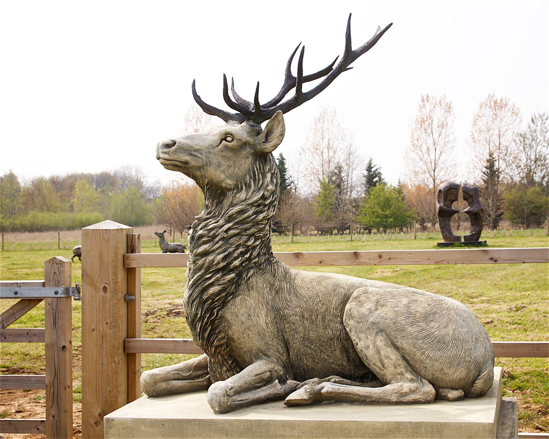Pair of Large Composite Stone Recumbent Stags on Plinths, 21st Century In Good Condition In Stratford upon Avon, GB