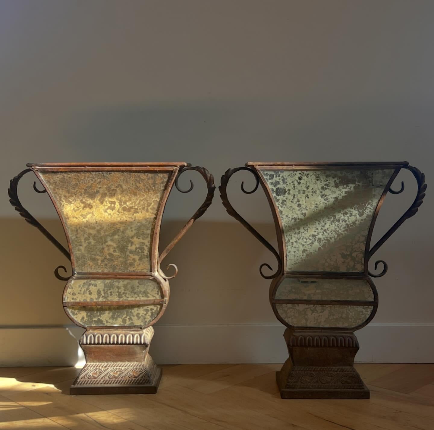 A pair of decorative metal and mirrored urns, 20th century. Good patina, not sure provenance - feels like Beaux Arts. Haussmannian texture. These vessels do not hold water so more for decoration and dried bouquets, branches etc. Pick up in LA or we