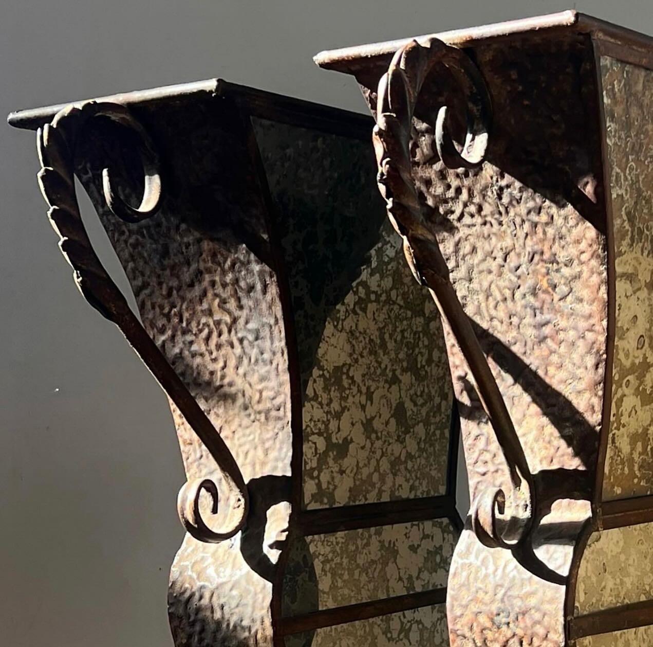 Unknown A pair of large decorative iron and mirrored urns, 20th century For Sale