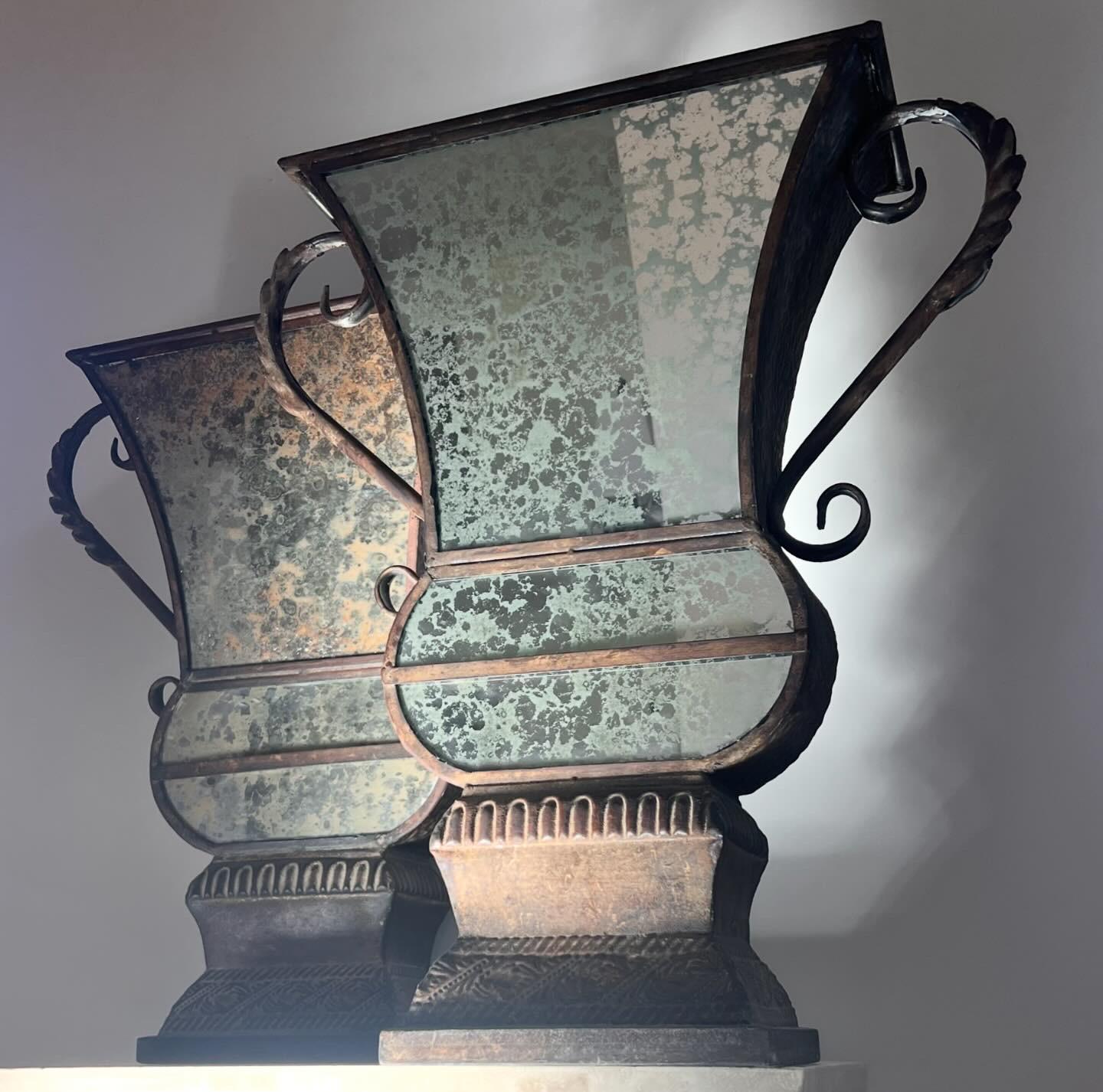 A pair of large decorative iron and mirrored urns, 20th century In Good Condition For Sale In View Park, CA