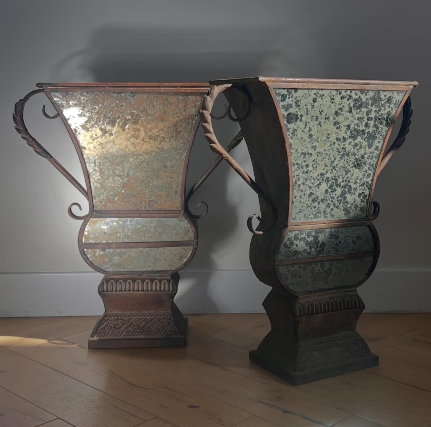 Metal A pair of large decorative iron and mirrored urns, 20th century For Sale