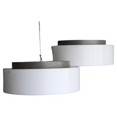 Un par de grandes lámparas de disco de Luxus Sweden diseñadas por Uno & Östen Kristiansson