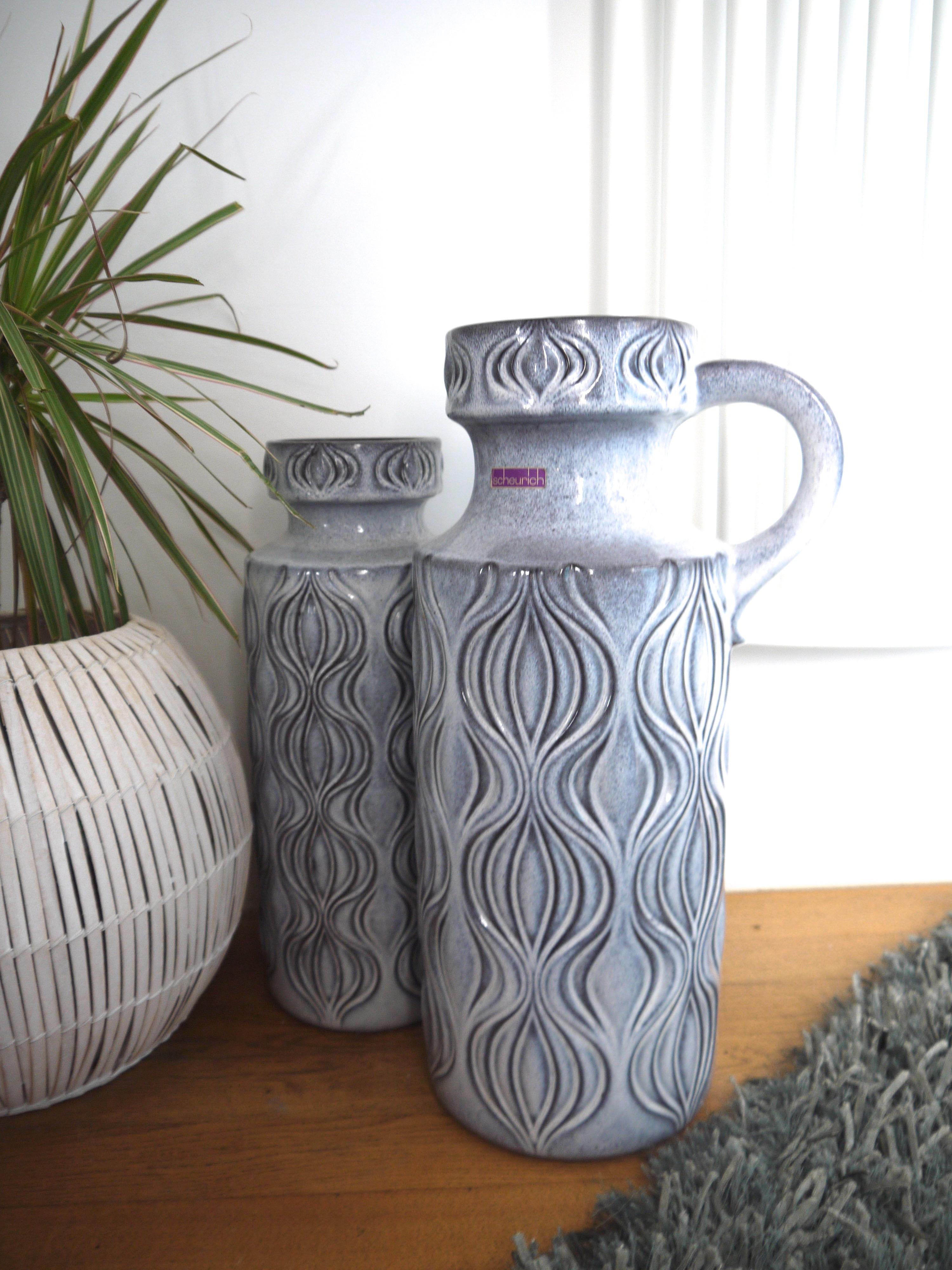 From Scheurich a pair of large dove-grey ‘Onion’ design ceramic floor vases, founded in 1928, Scheurich were originally a wholesale provider of glass, china and ceramics. The ceramics production took centre stage in the 1950s – the date of these