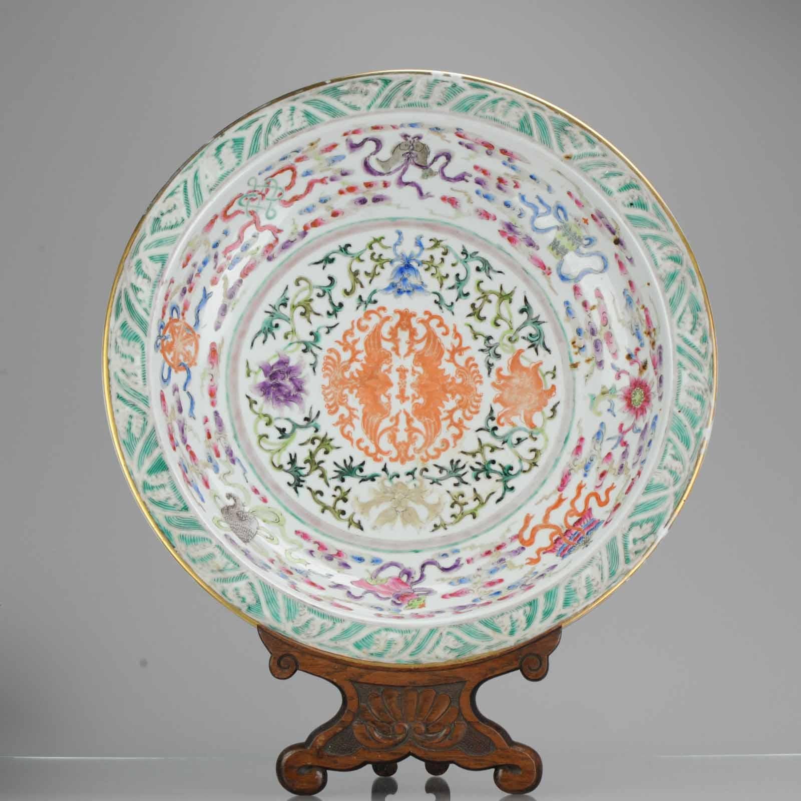 A pair of large famille rose 'phoenix and Buddhist Emblems' chargers
19th century
The wide, heavily potted dishes each brightly enameled to the centre with confronting phoenix surrounded with a lotus flower head Meander, further encircled with the