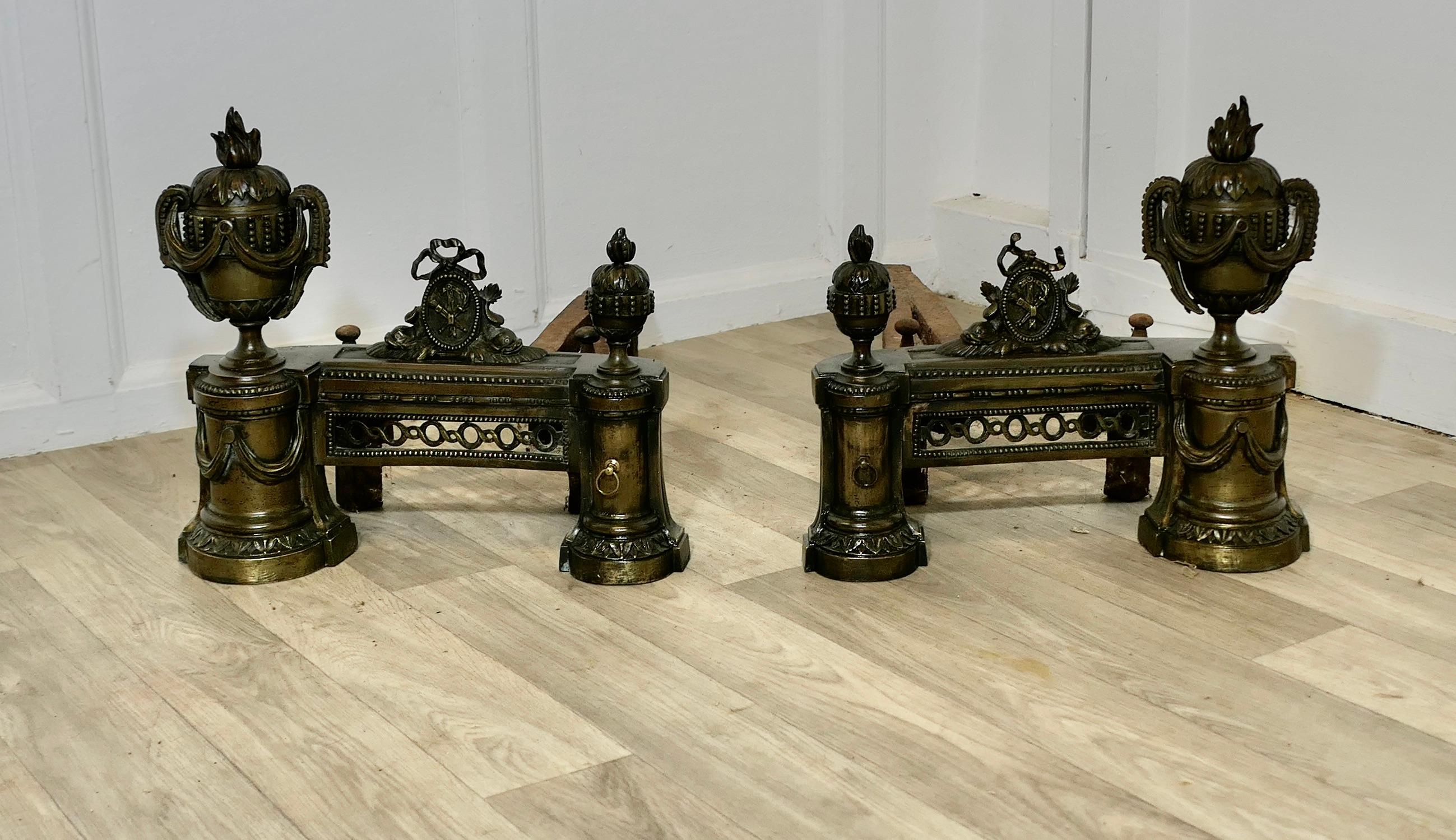 A Pair of Large French 18th century Brass Chenets 

This is a VeryAttractive pair of French Chenets, the ultimate in Chateau Chic

They are sculptured on brass in the shape of classical urns  decorated with  swags and flame decoration, we do not
