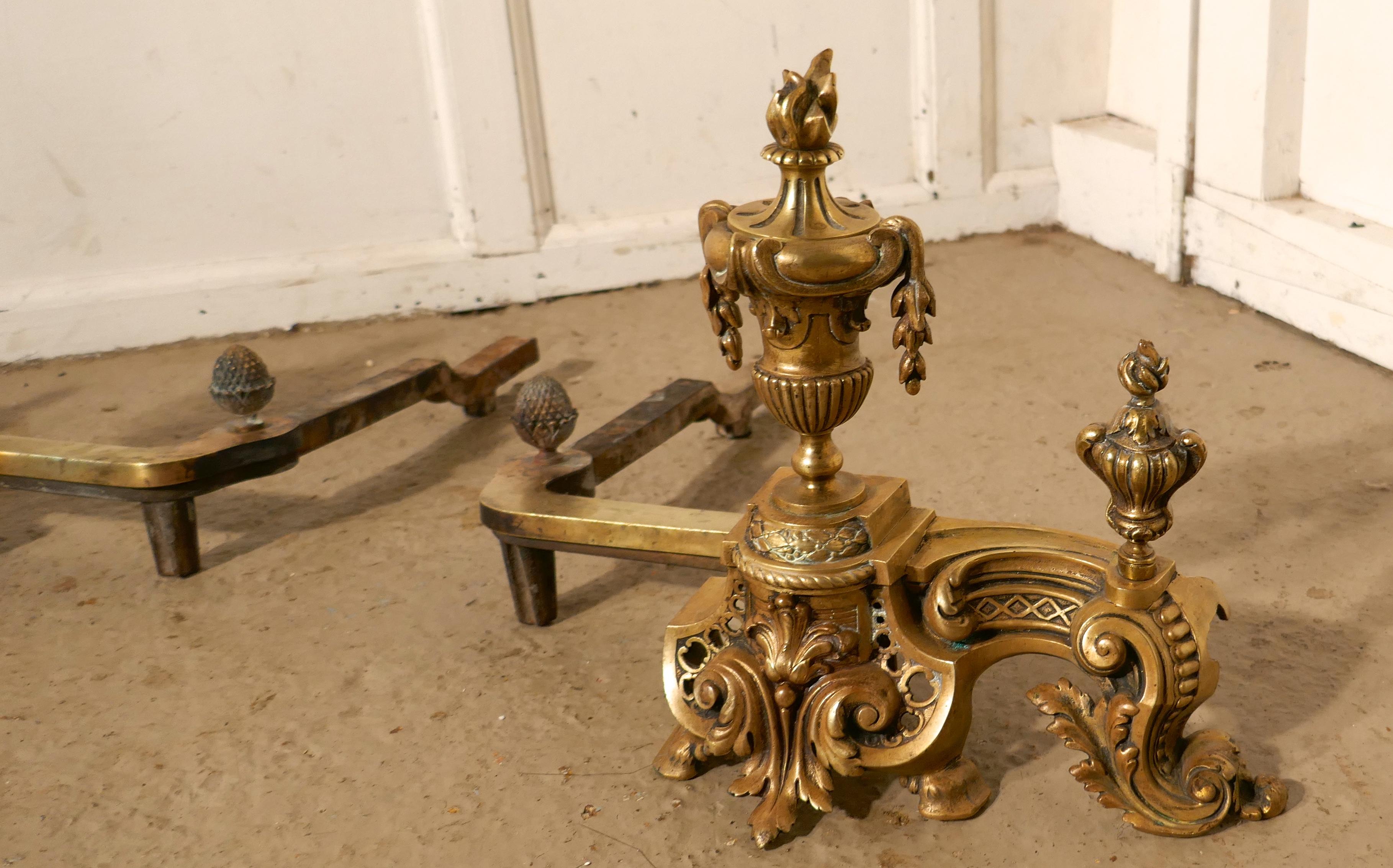 A pair of large French Rococo brass andirons or chenets

This is a very large pair of french brass andirons, the ultimate in Chateau Chic

They are made of cast brass in the shape of Classical Greek urns decorated with many swags and acanthus