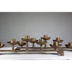 Pair of Gothic Revival heavy brass candelabras with 5 graduating candle holders.