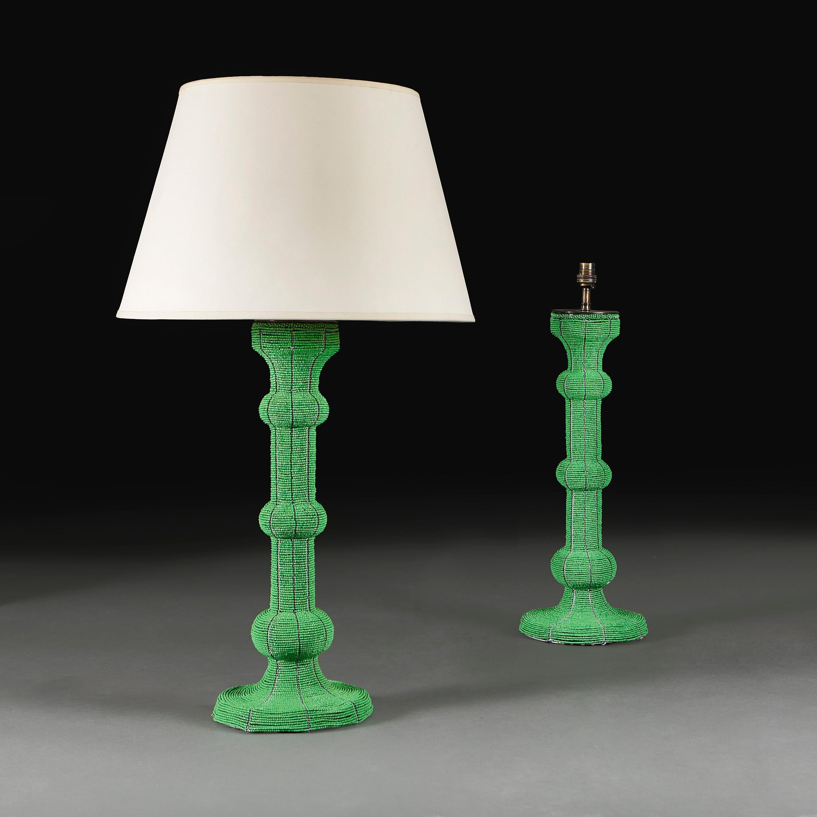 South Africa, modern

A pair of green beaded Zulu candlestick lamps of large scale, of baluster form with circular base.

Please note:
Lampshades not included. Lamps have been photographed with a 18” pale cream Pembroke card lampshade.

Currently