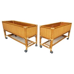 A pair of large Italian 1970s bamboo and rattan planters on castors