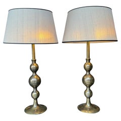 A pair of large Italian 1970s solid brass lamps with orignal satin shades