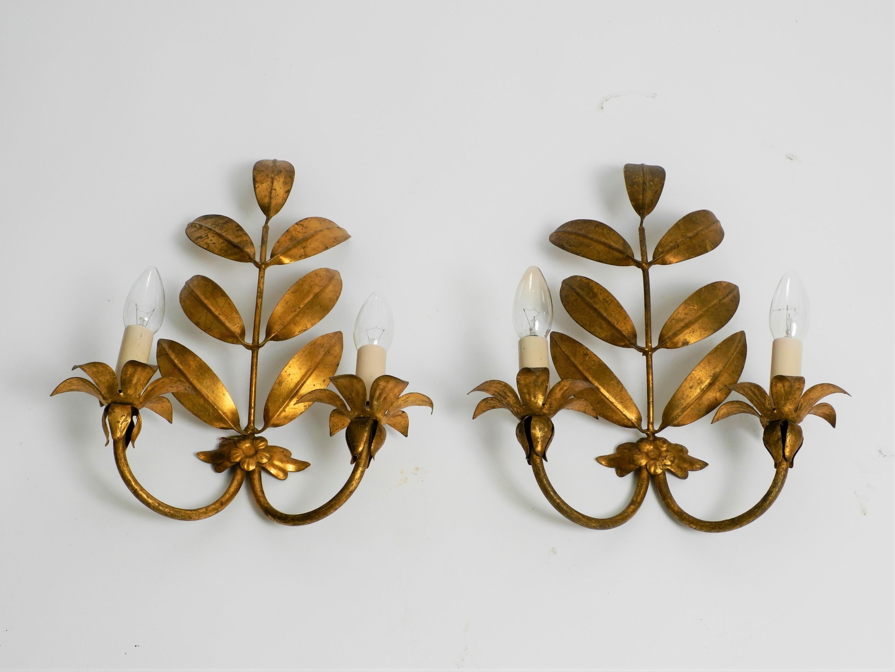 Pair of rare 1960s large Florentine wall lamps, made in Italy.
Many large curved leaves. Very high quality production. Beautiful design with many derails.
Entire lamp is made of heavy gilded iron.
Fully functional and 100% original.
All parts