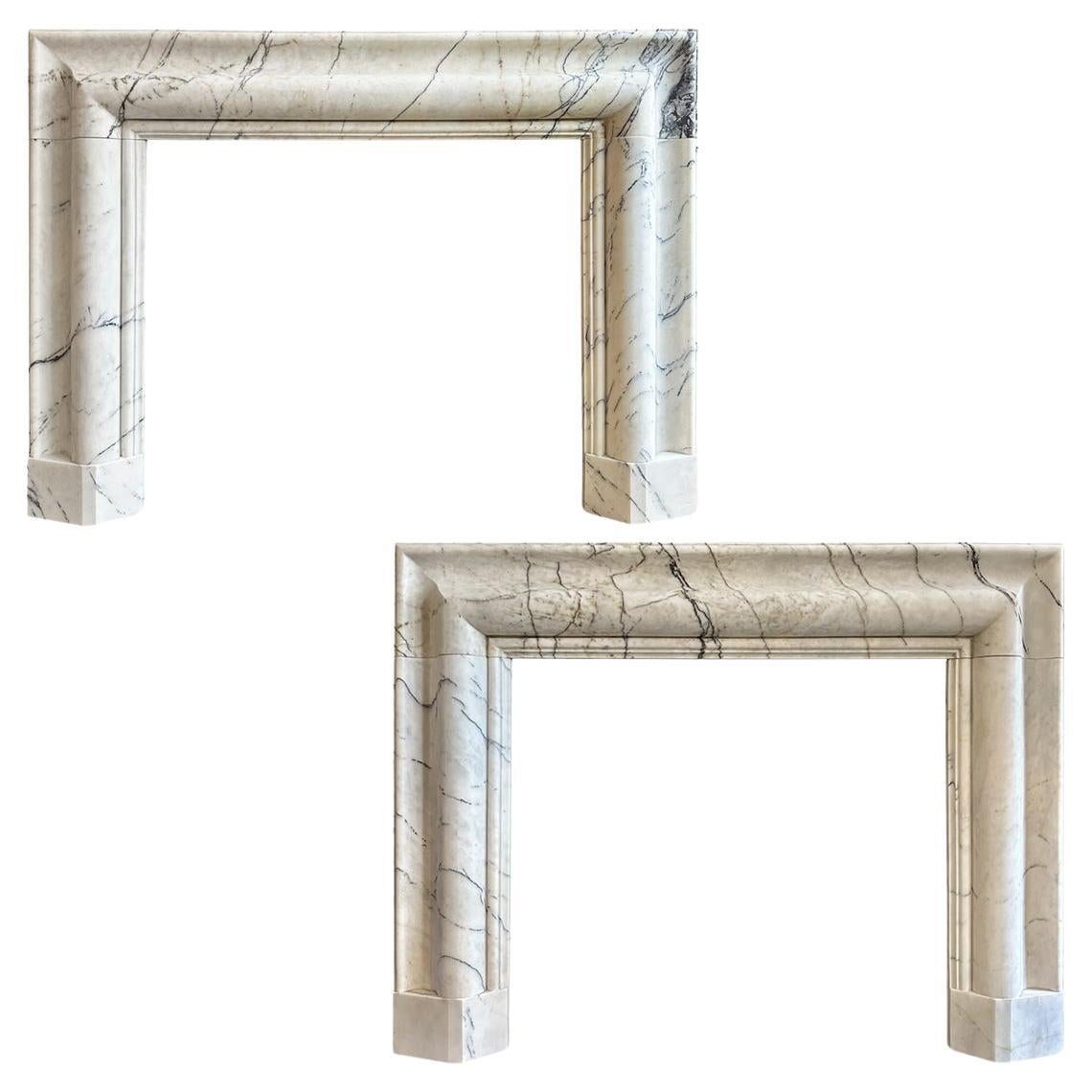 A Pair Of Large Marble Bolection Fireplace Mantles  For Sale