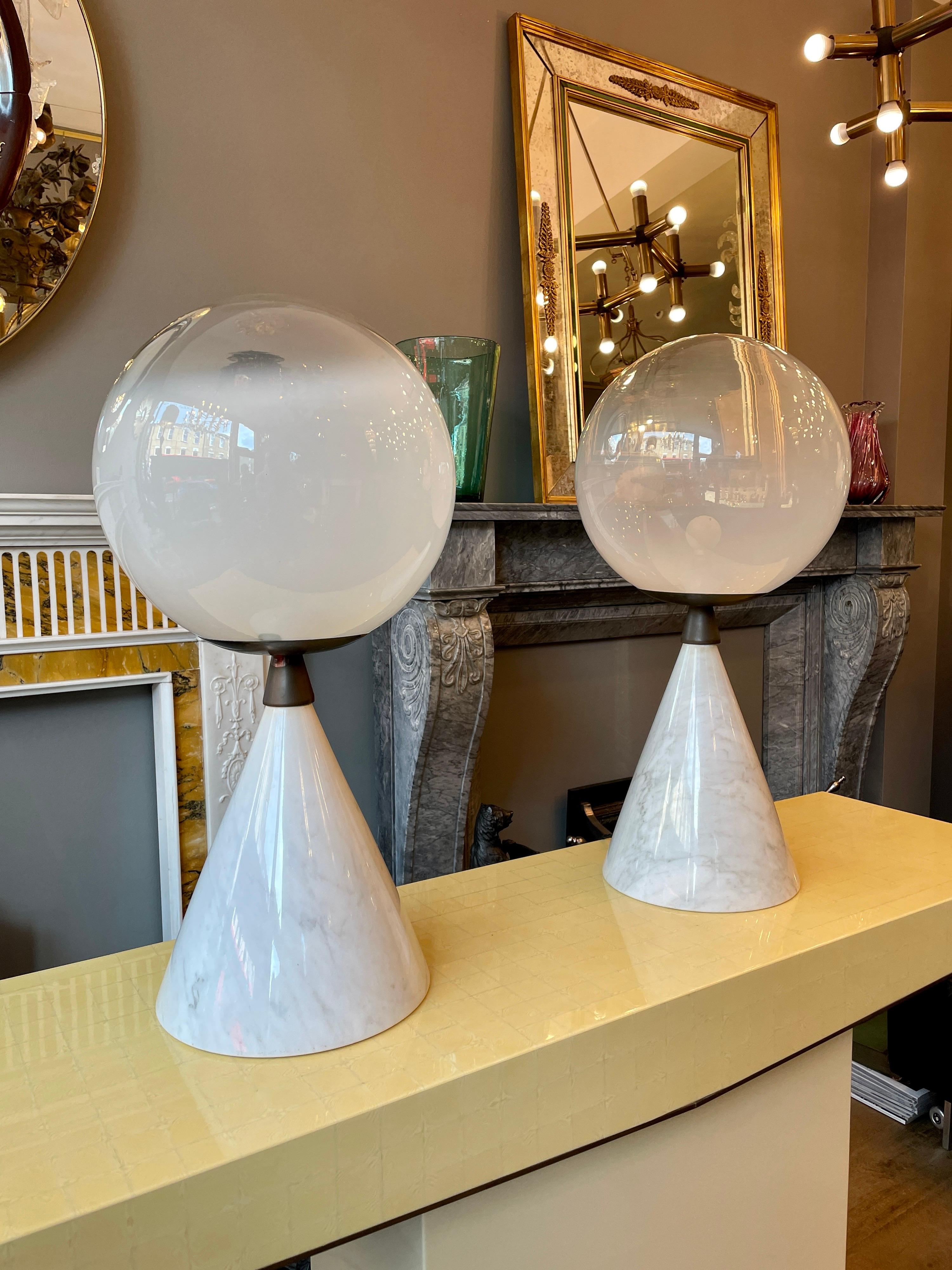 A large pair of Post Modern Italian table lamps with conical Carrara marble bases, bronze mounts, fittings and large semi opaque Murano glass globe shades. Very good quality and dimensions 
Italy Circa 1970.