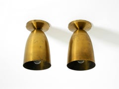 A pair of large, original Mid Century Modern brass ceiling lamps