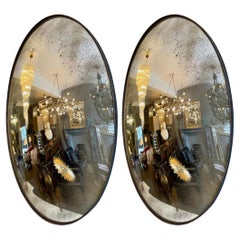 Paar große ovale konvexe Spiegel