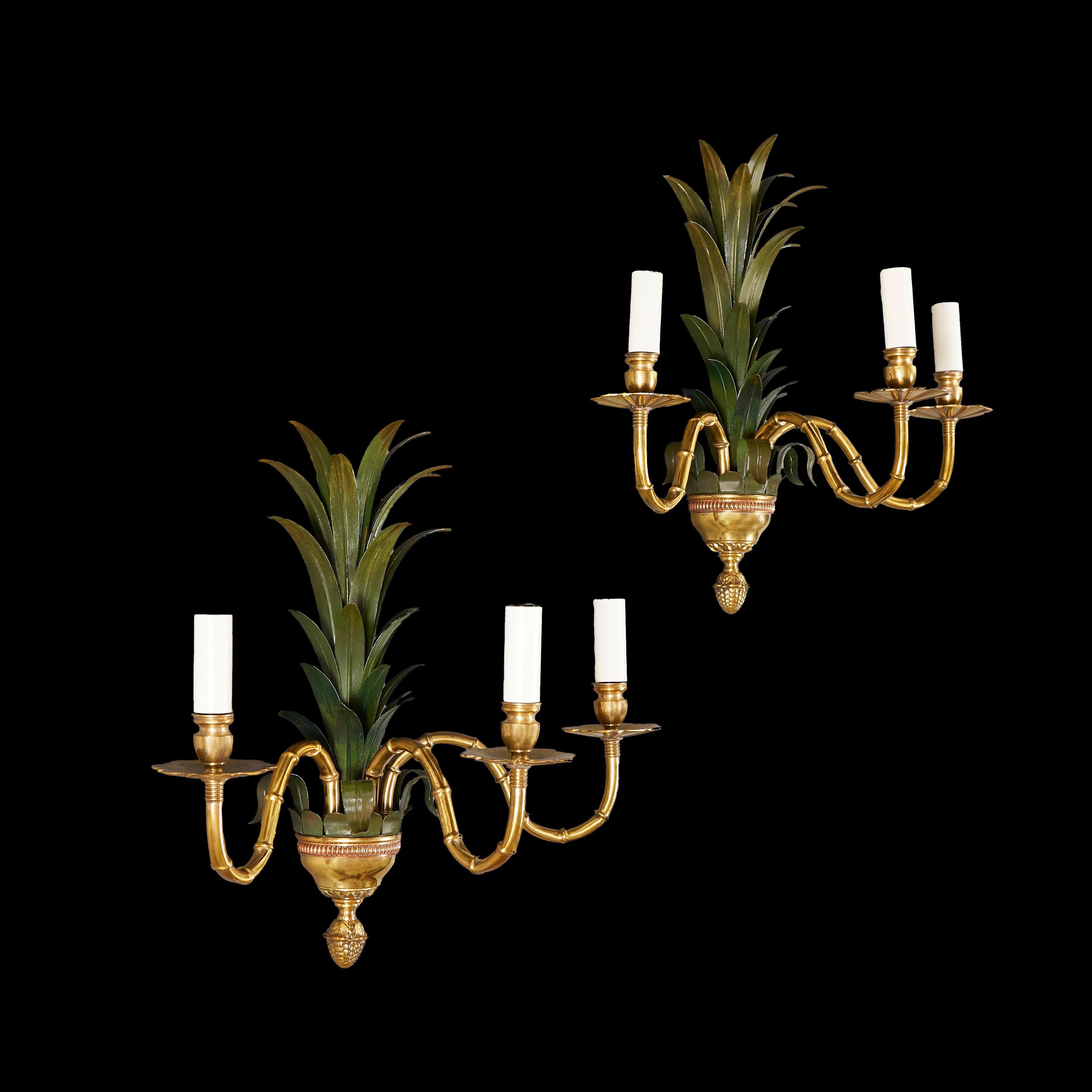 France, circa 1920

A fine pair of large early twentieth century palm frond three branch wall lights, painted in green, with bamboo articulated brass arms, below a finely cast acorn finial. Attributed to Maison Jansen.

Height 48.00cm
Width