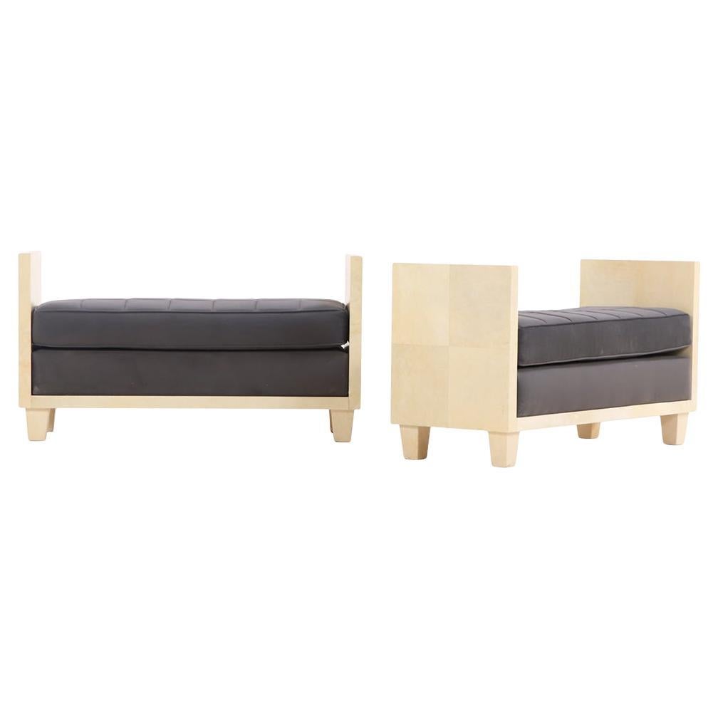 A pair of large parchment covered upholstered benches.