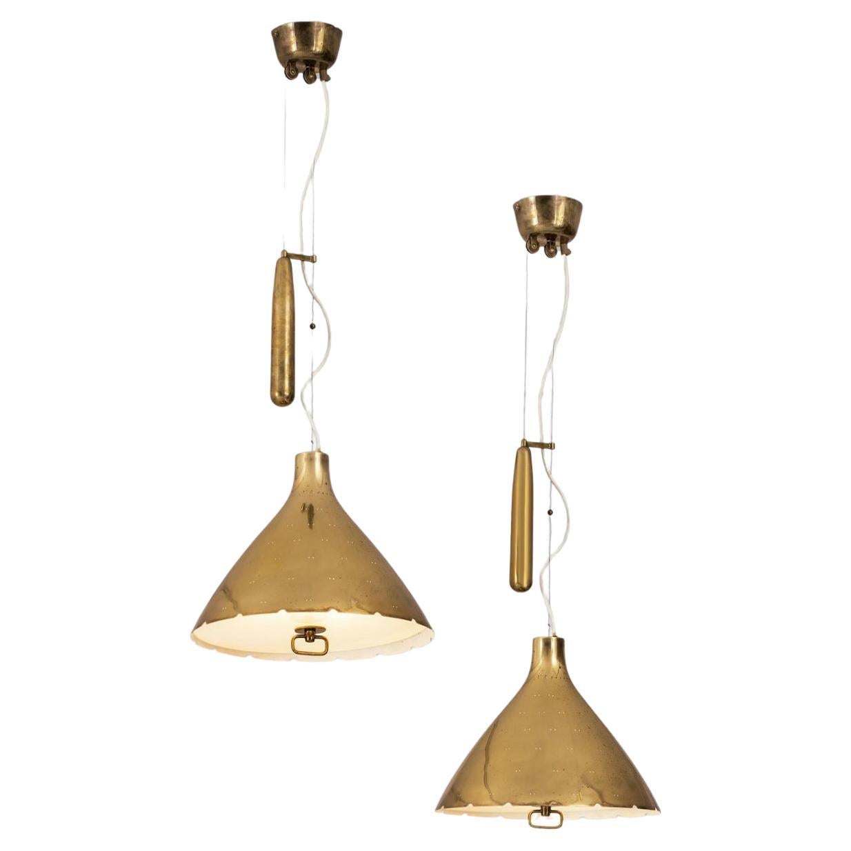 Pair of Large Pendants by Paavo Tynell
