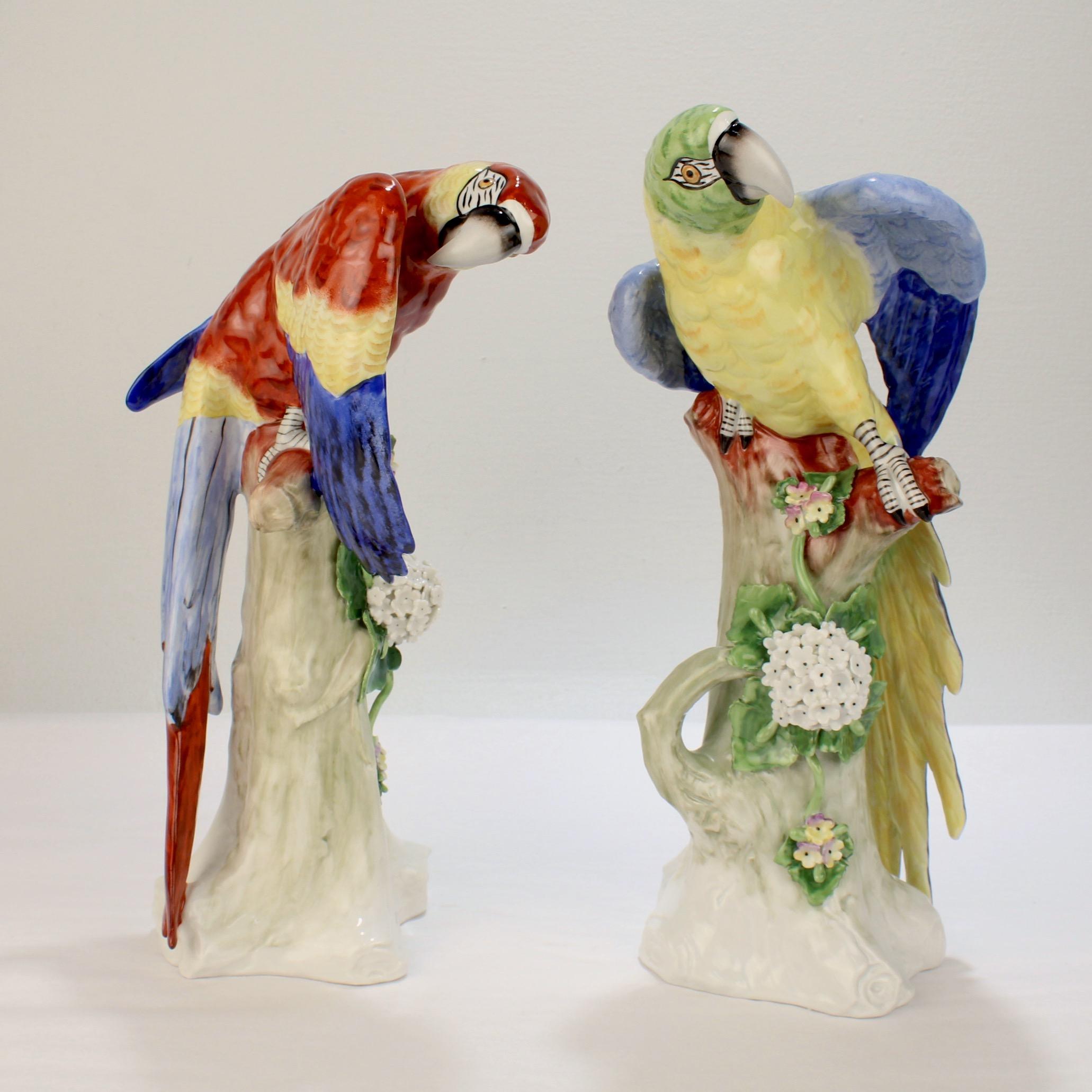 A fine pair of vintage German porcelain figurines.

Modeled as large Macaw parrots on tree stumps.

Polychrome decorated with three-dimensional flowers and leaves.

Simply impressive, beautiful birds!

Date:
20th Century

Overall