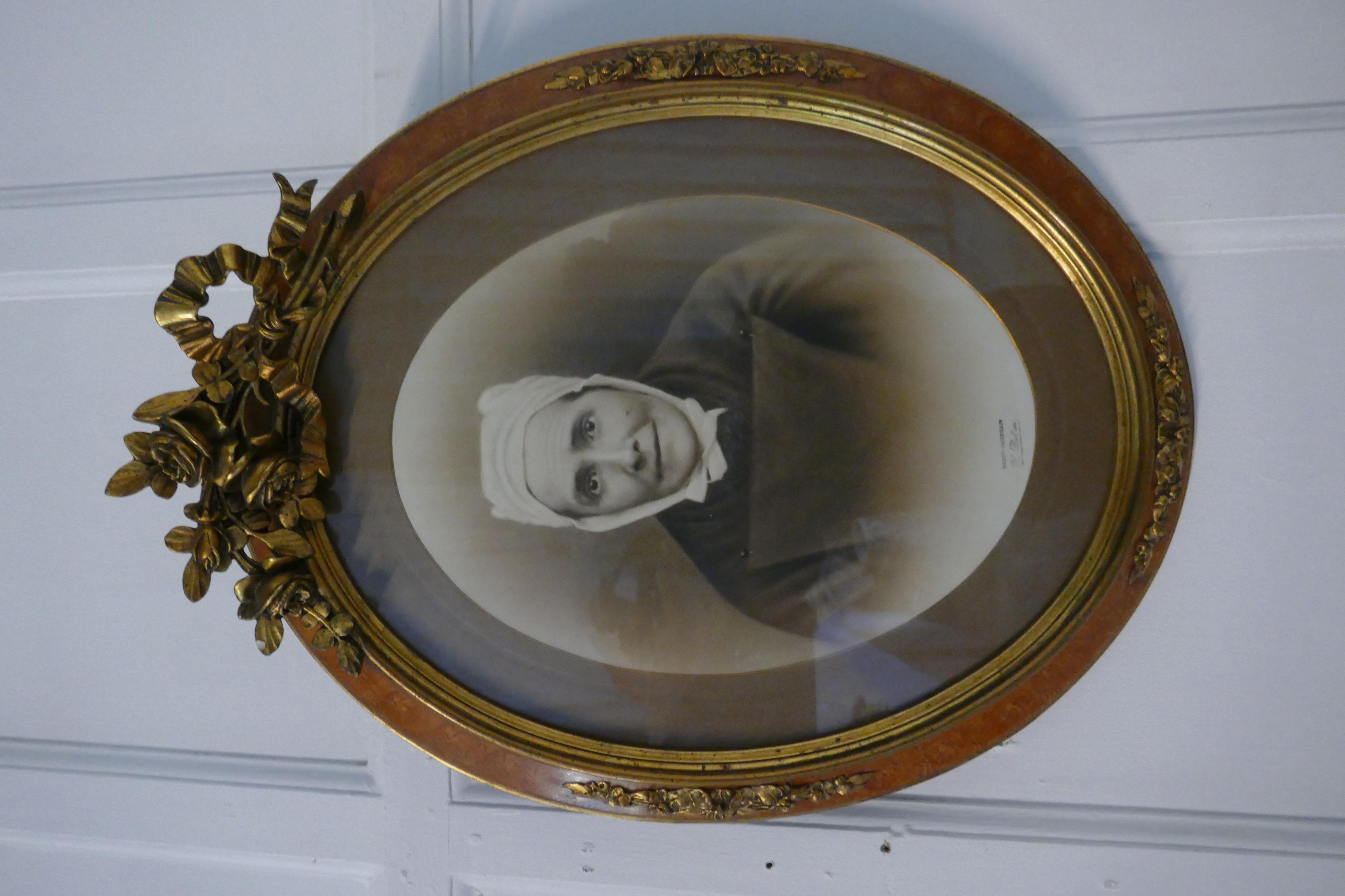 Victorian Pair of Large Portrait Photographs in Oval Ormolu Frames For Sale