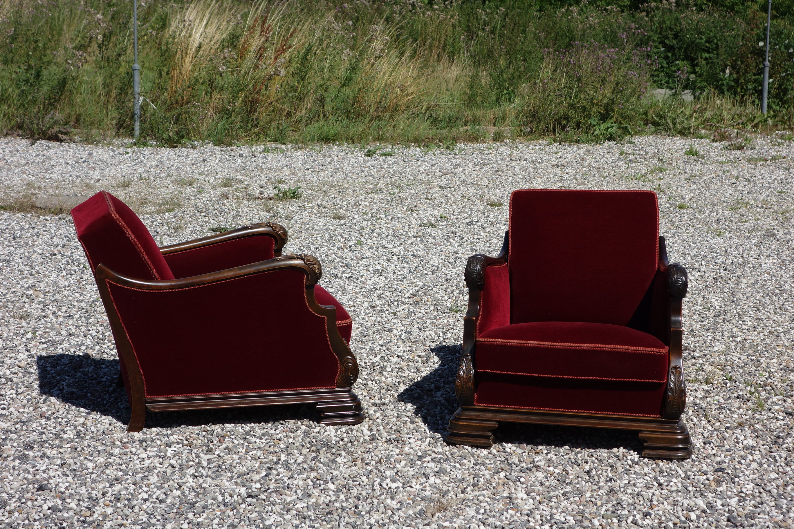 A fantastic pair of vintage Art Deco armchairs in heavy quality exclusive red velor. These chairs are large and offer comfortable seating. They are offered for sale individually but would make a stunning pair the right place.