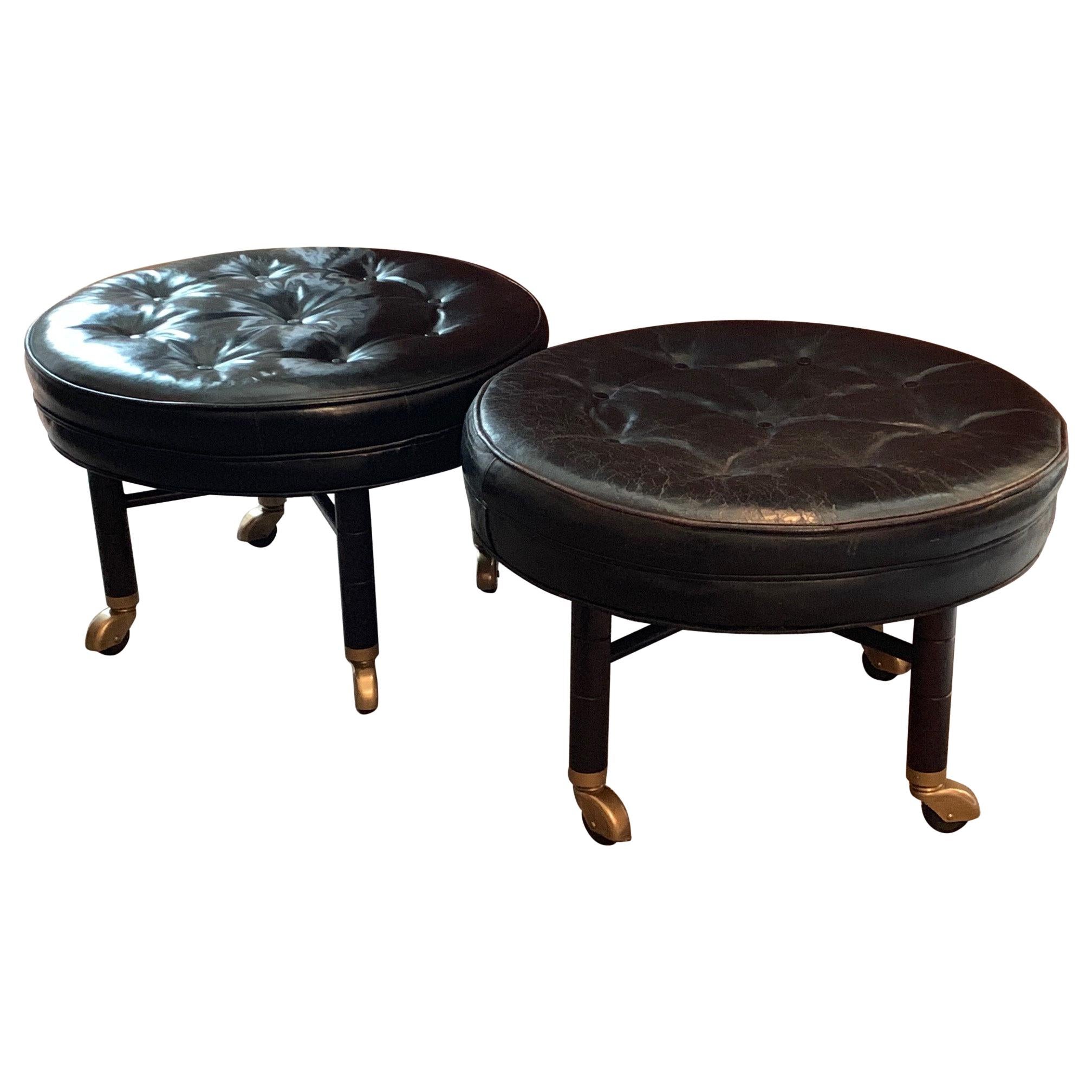 A Pair of Large Round Leather Ottomans by Baker