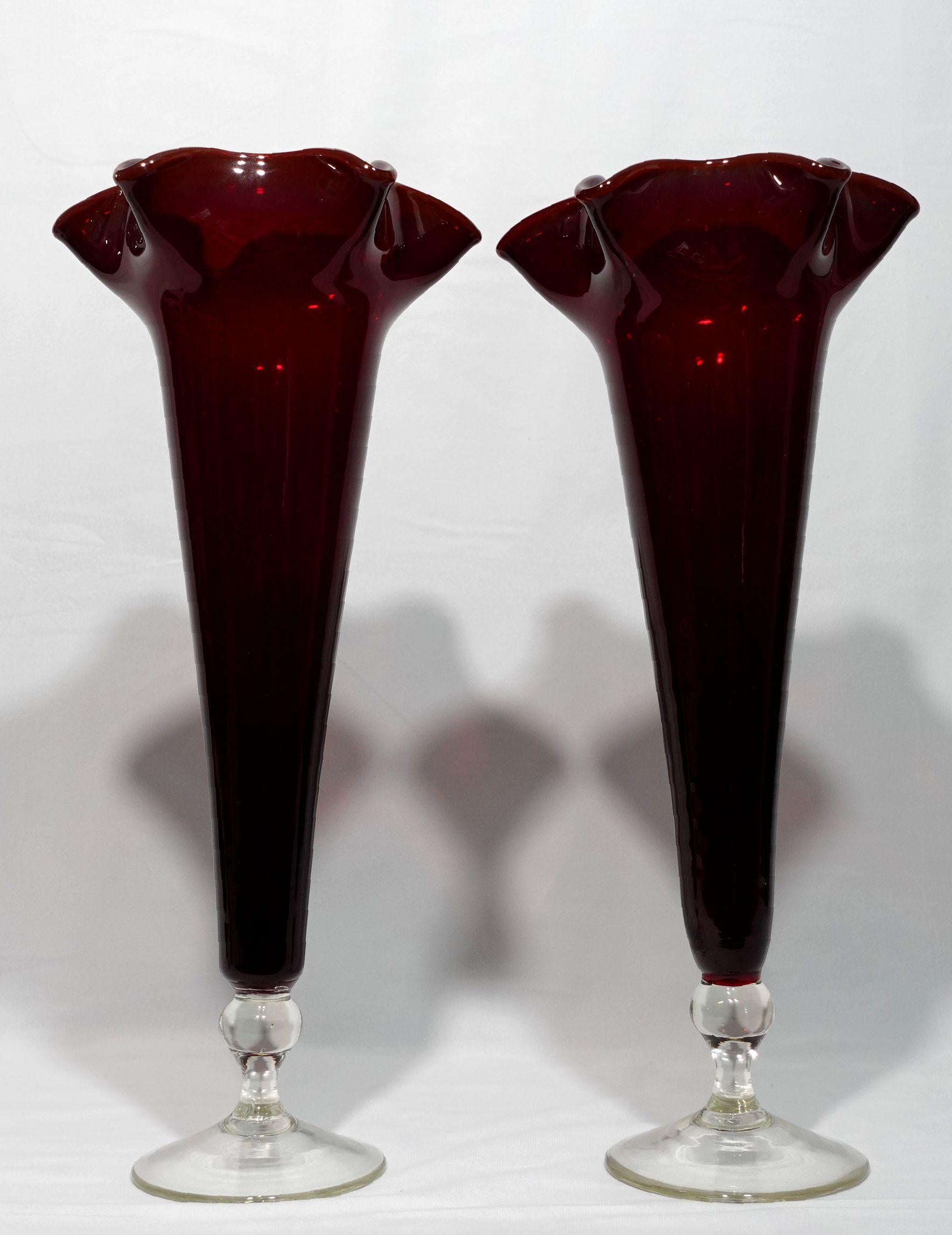 A Pair of Large Ruby and Clear Trumpet Vases with a very rich ruby color down to the base became clear. They have very elegant forms from the circular bases narrowed up and increased the diameters of the body to form the trumpet shapes with the