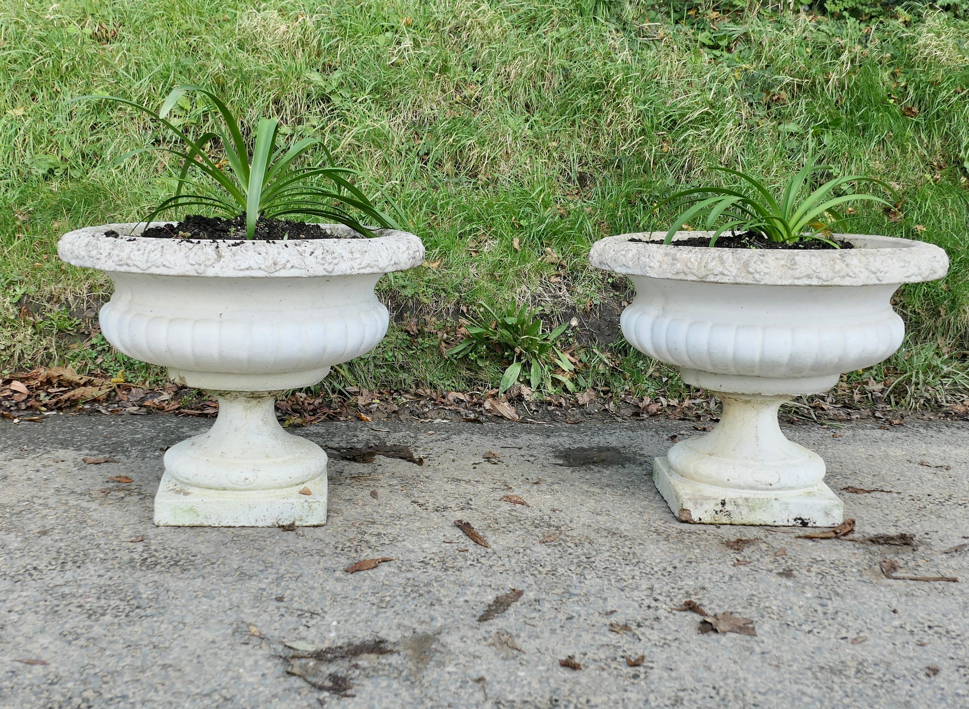 A Pair of Large Weathered Cast Stone Garden Planters

A good pair of early 20th century planters, they are well weathered and were painted some years ago, they have drainage in the centre
In good sound condition, very heavy, they are 20” high, 25”
