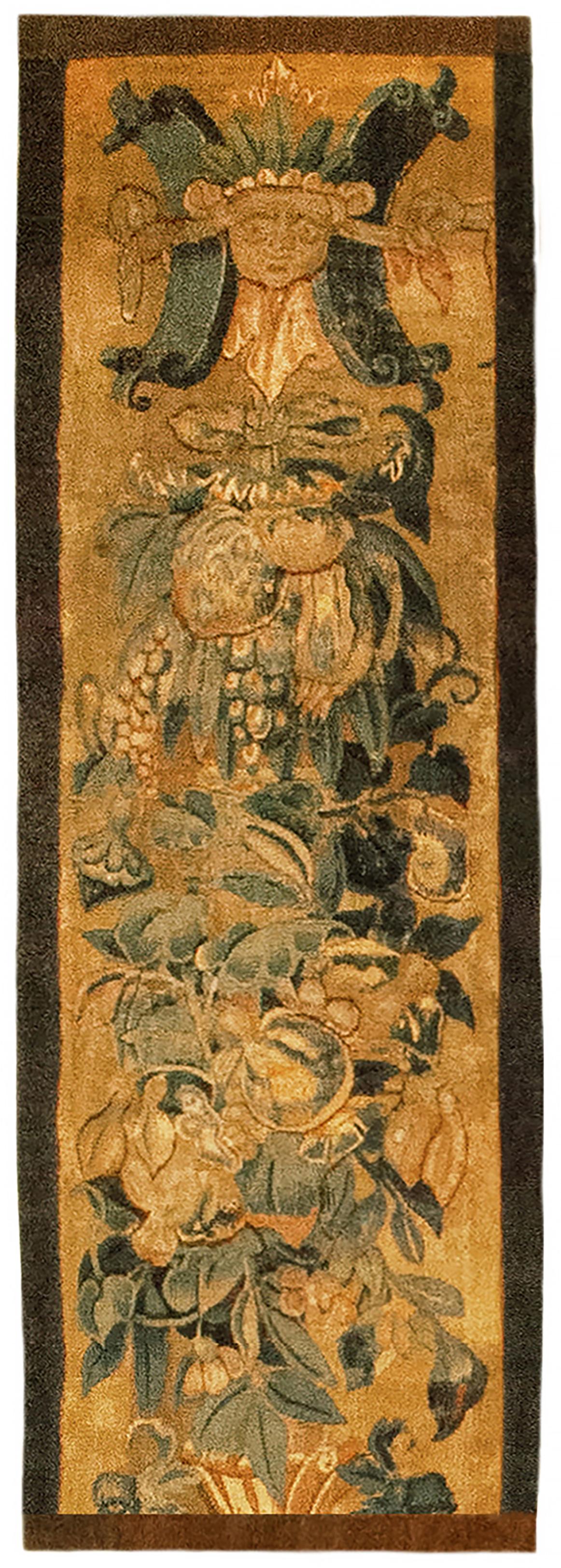 A pair of 16th century Brussels Historical Tapestry panels. This vertically oriented pair of decorative tapestry panels depicts scrolling foliate designs, with grotesques on the top, and with variety of fruiting and flowering elements below. The