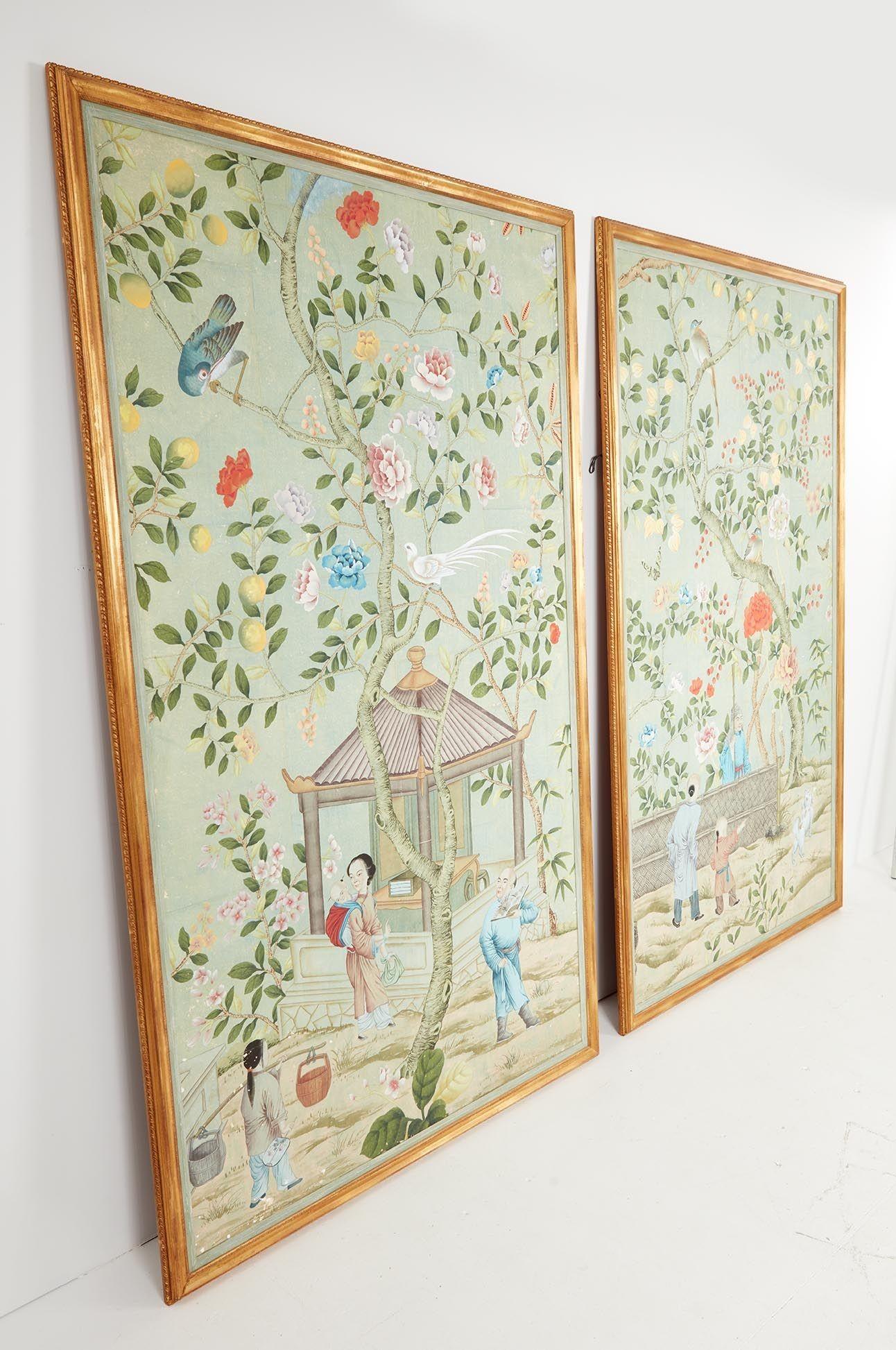 An important pair of late 18th century Chinoiserie wallpaper panels in gilt frames featuring scenes of pleasure gardens. The hand-painted papers feature a palette orange, pinks, yellows, gold on a celadon ground. Humans in traditional costume,