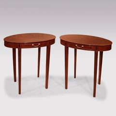 A pair of late 18th century Sheraton period mahogany oval occasional tables