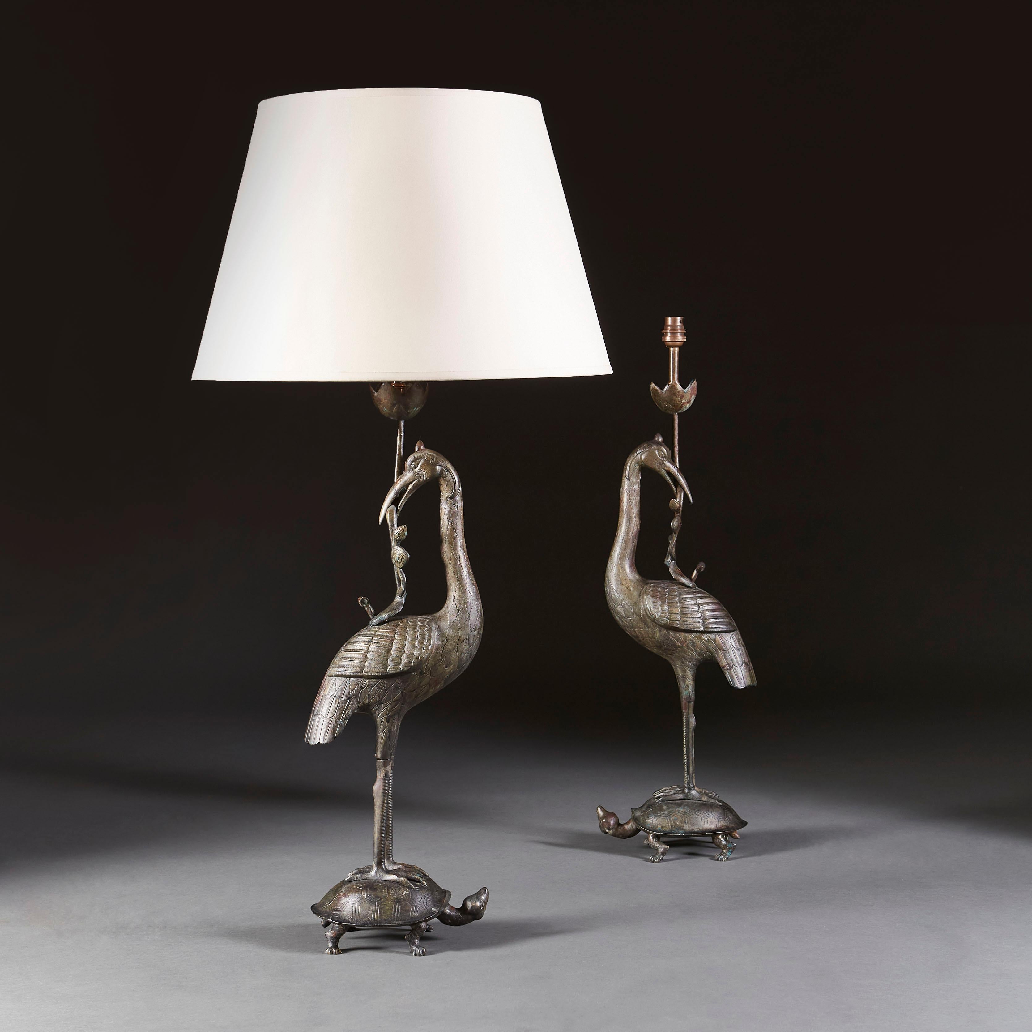 A pair of late nineteenth century Chinese bronze lamps, with a stork holding a branch in it's beak standing atop a tortoise.

Currently wired for the UK. Please enquire for rewiring services.

Please note: Lampshades not included.