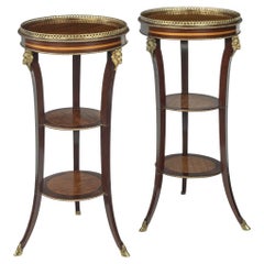 A pair of late 19th century French 3 tier satinwood side tables