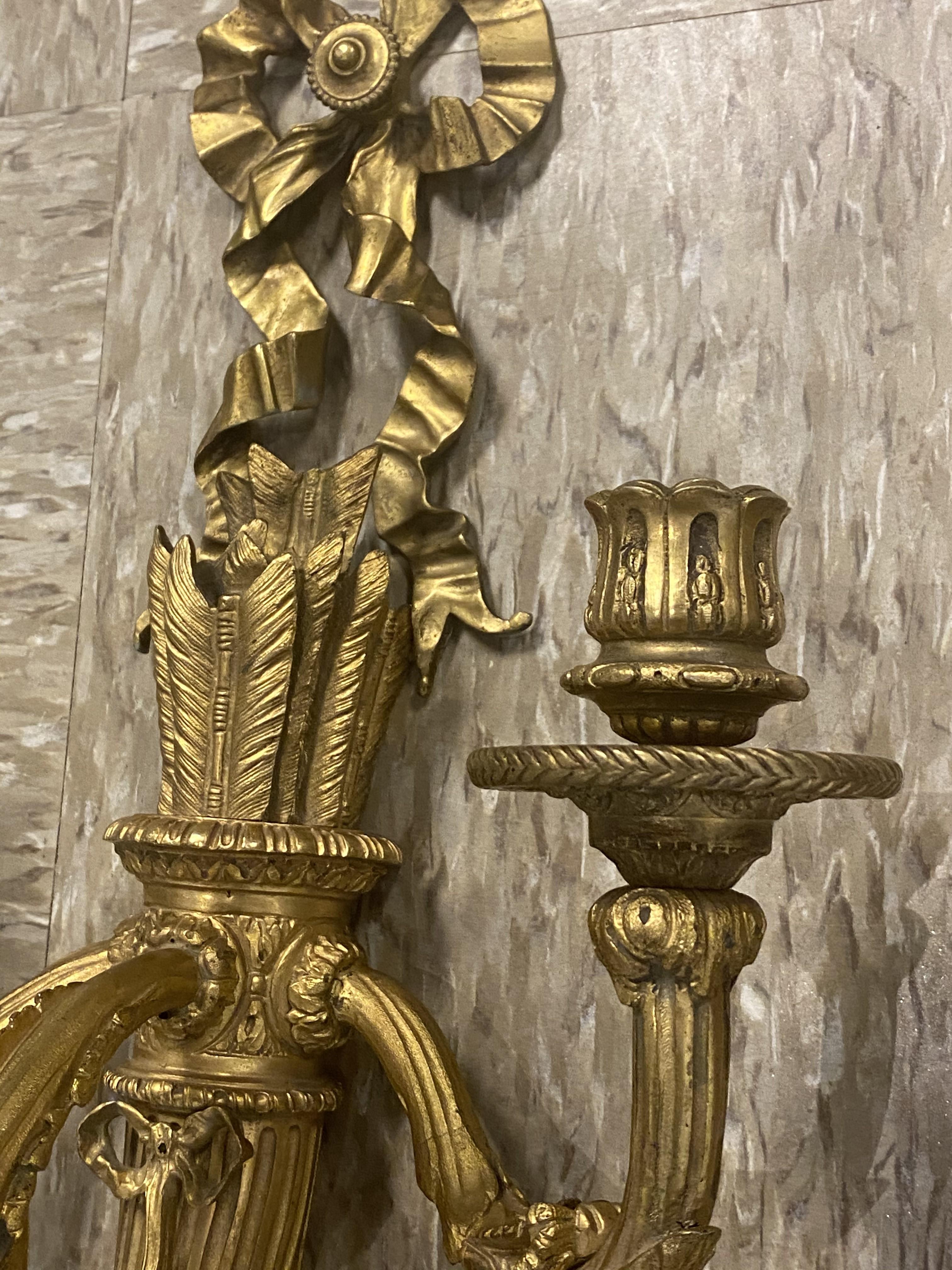 A pair of circa 19200 French gilt bronze sconces with 3 lights, beautiful details.