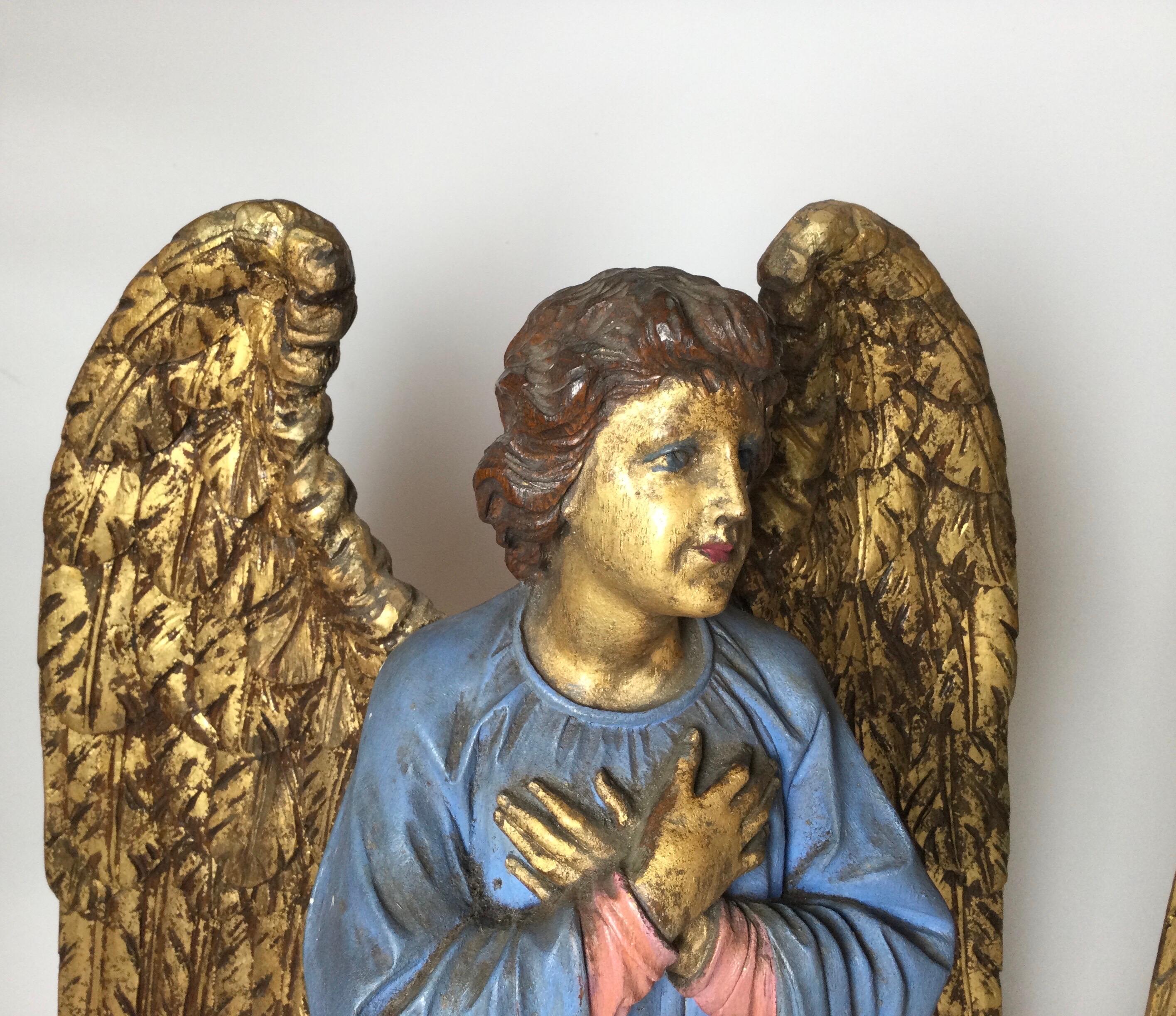 A pair of European hand carved, polychromed and gilt altar angels circa 1890-1900, from a NYC church.