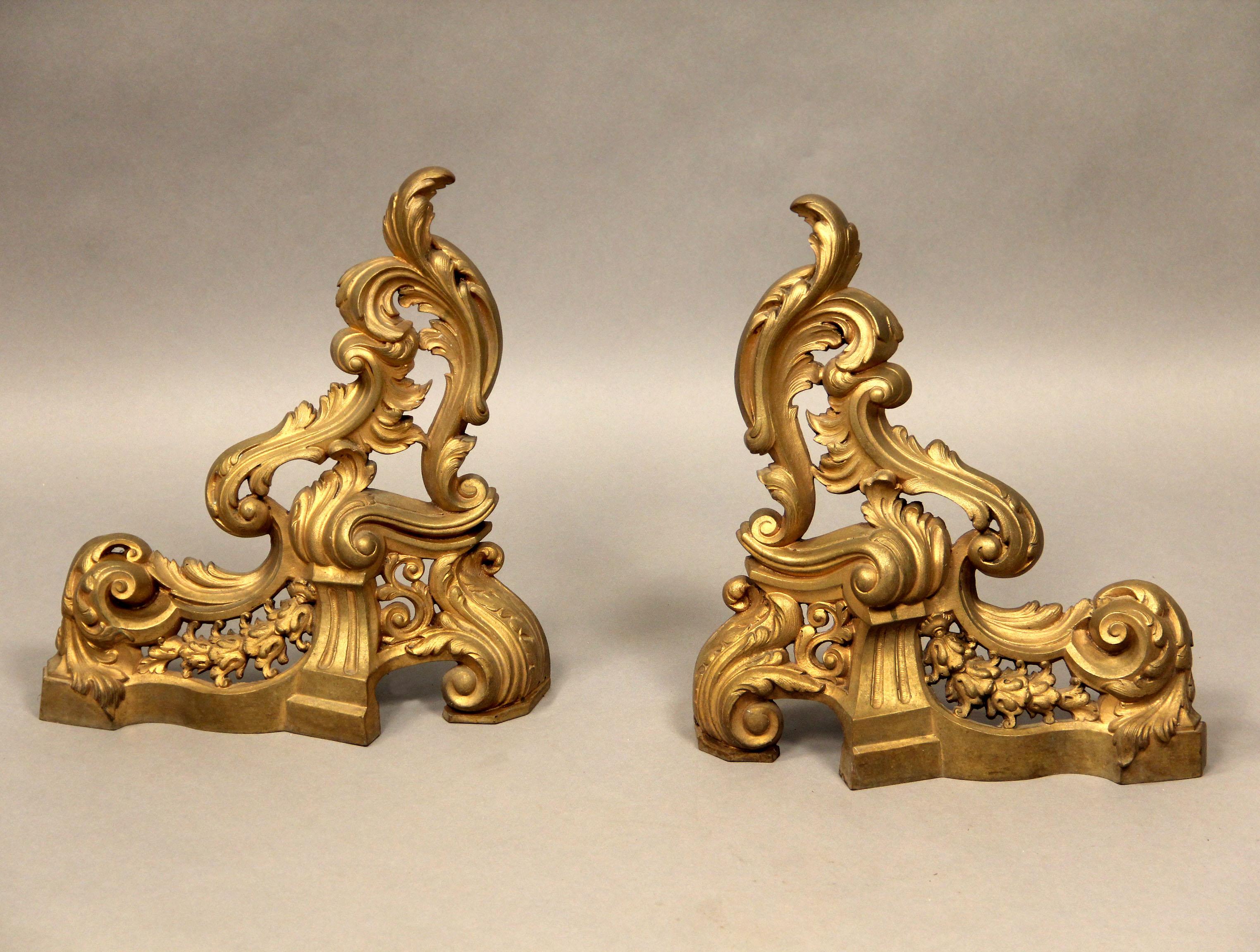 A Pair of late 19th/ early 20th century Bronze Chenets.

Modeled with scrolling acanthus.