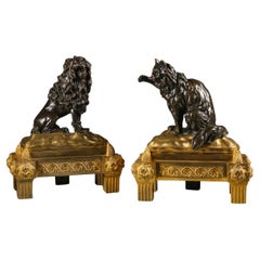 A Pair Of Late Louis XV Period Chenets, Attributed to Jacques Caffieri