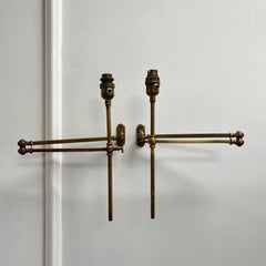 A pair of late nineteenth century articulated brass wall lights