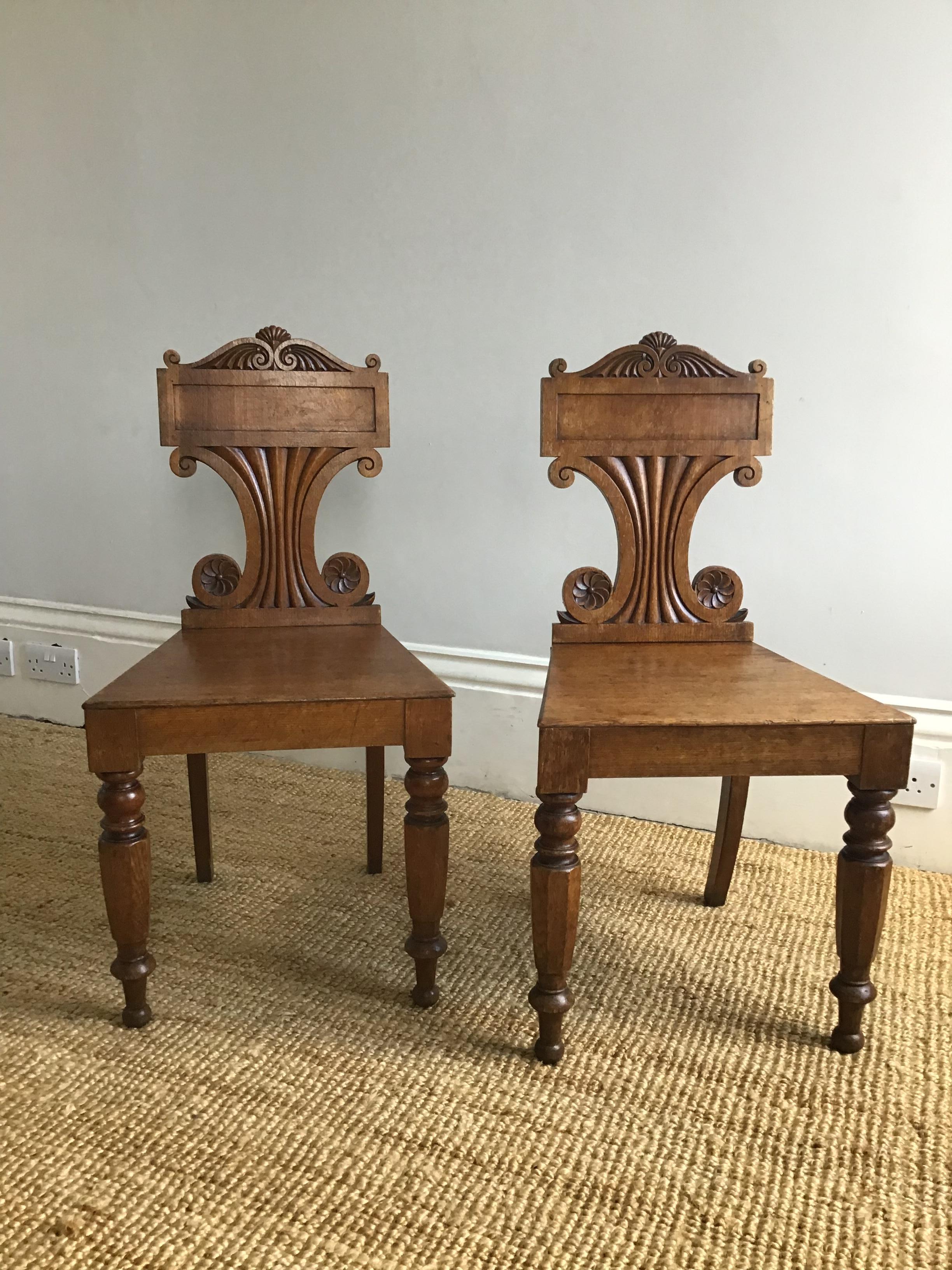 English Pair of Late Regency Oak Hall Chairs For Sale