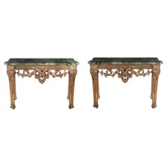 A pair of late Victorian marble and giltwood console tables