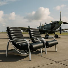 A pair of leather and aluminium 1940s Christie Tyler Aeroplane chairs