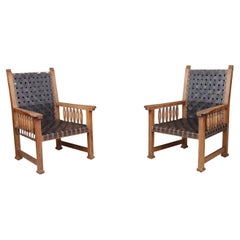Paire de fauteuils en cuir et Oak Oak, France, années 1950.