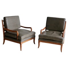 A pair of leather armchairs